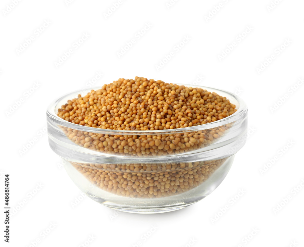 Bowl of mustard seeds on white background