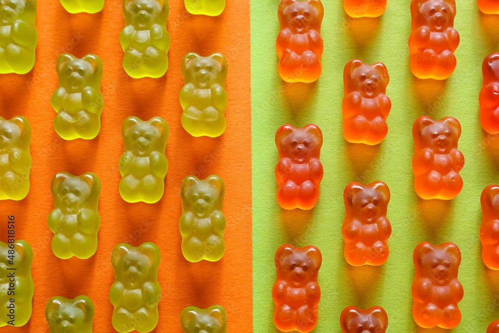 Yummy jelly bears on color background, closeup