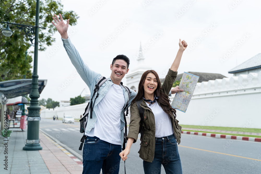 Asian attractive romantic couple travel in the city for honeymoon trip. 