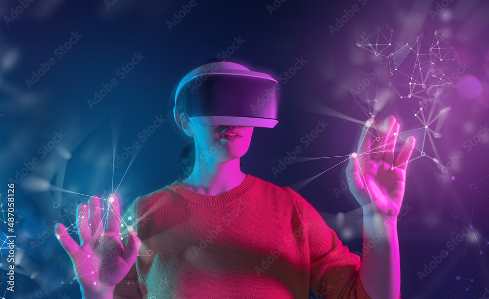 Woman with VR virtual reality goggles