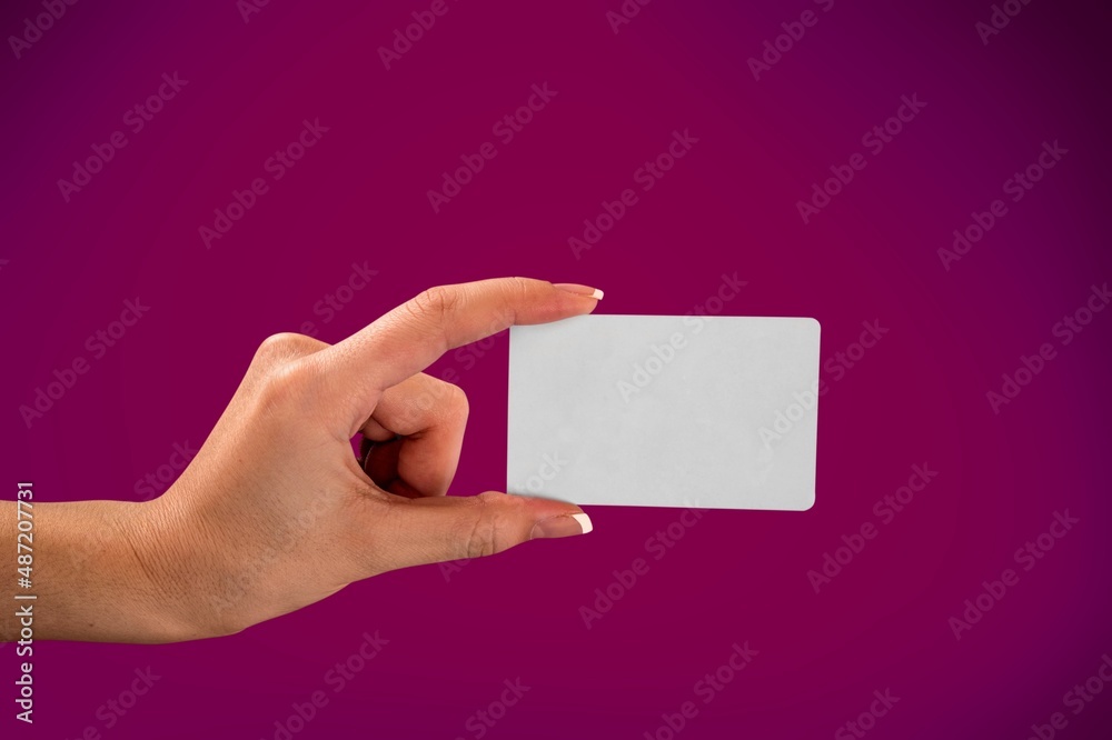 A female hand hold mockup Bank credit card with online service