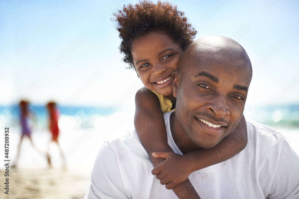 Ill never let go, daddy. Portrait of a daughter and father enjoying a day on the beach.