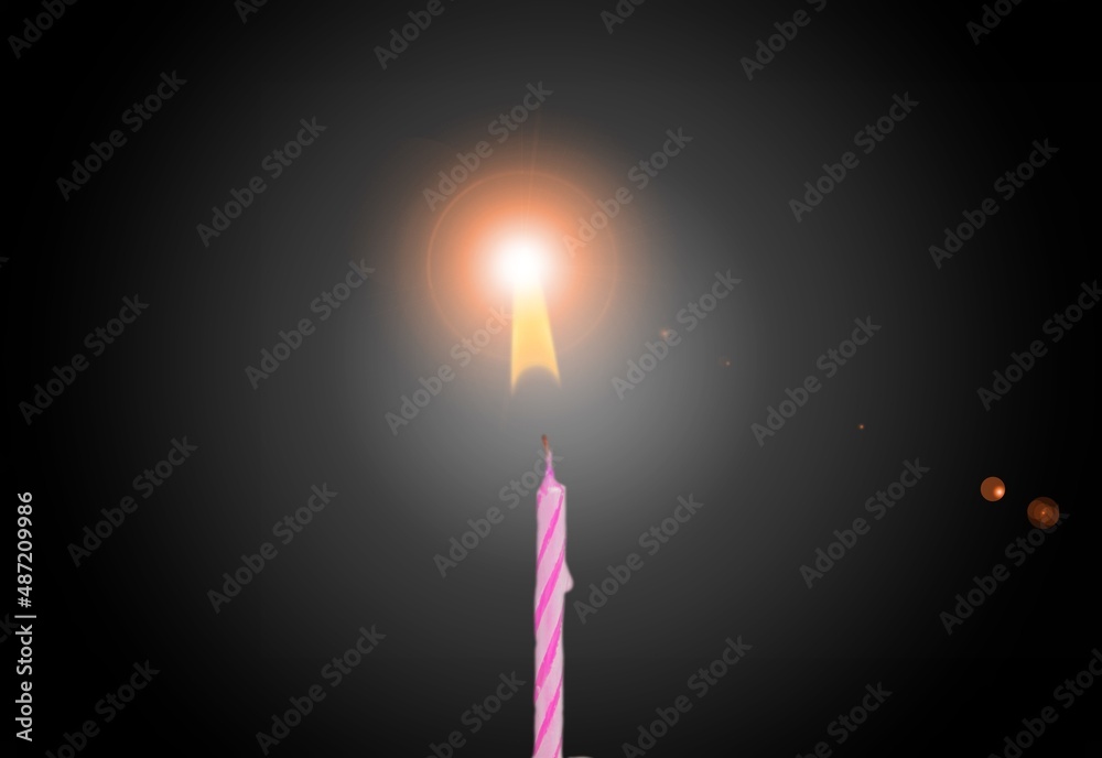 one candle on black background, birthday concept