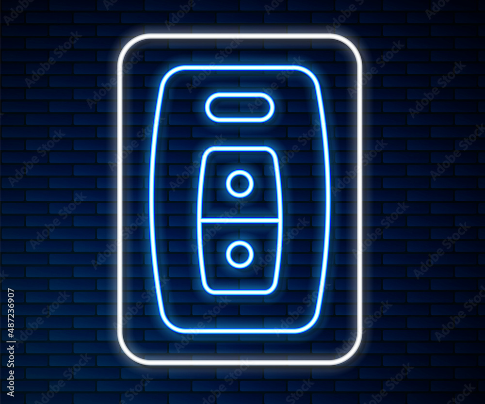 Glowing neon line Car key with remote icon isolated on brick wall background. Car key and alarm syst