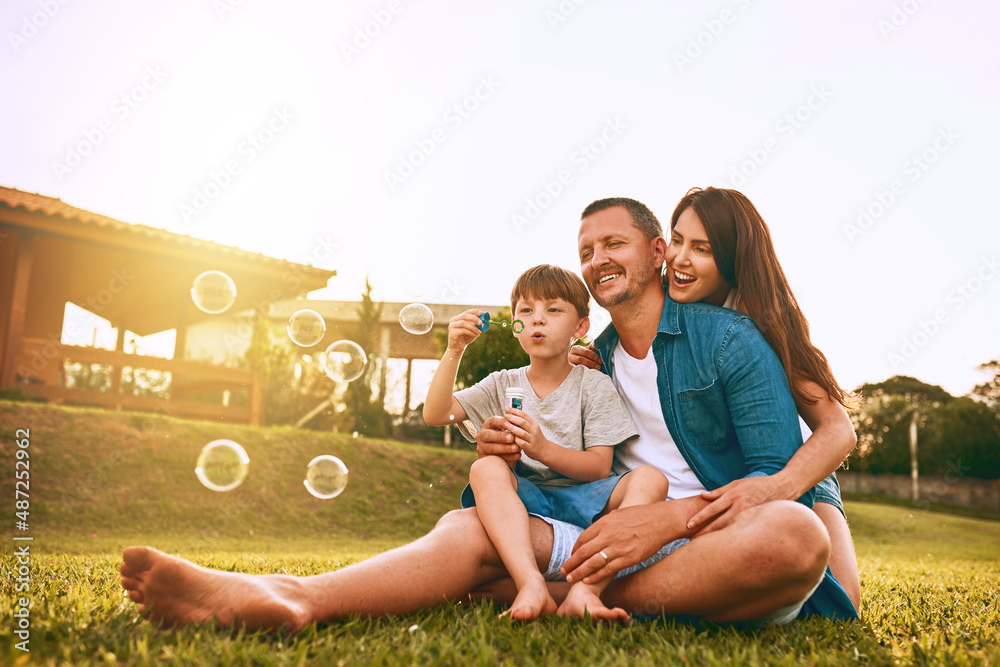 Nothing says family fun like blowing bubbles. Cropped shot of a young family spending time together 