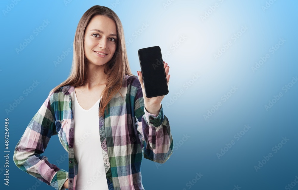 Portrait photo of young beautiful woman feeling happy or surprise shock and holding smart phone