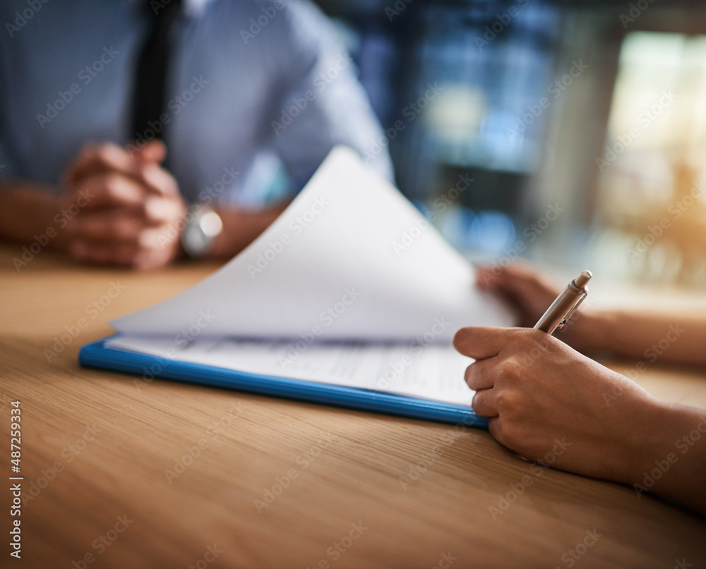 Making sure every detail is covered. Cropped shot of a man and woman completing paperwork together a