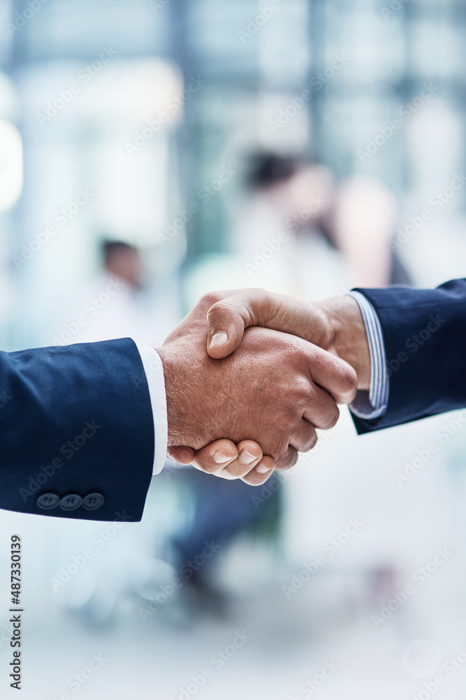 I look forward to working together. Cropped shot of two unrecognizable businesspeople shaking hands 