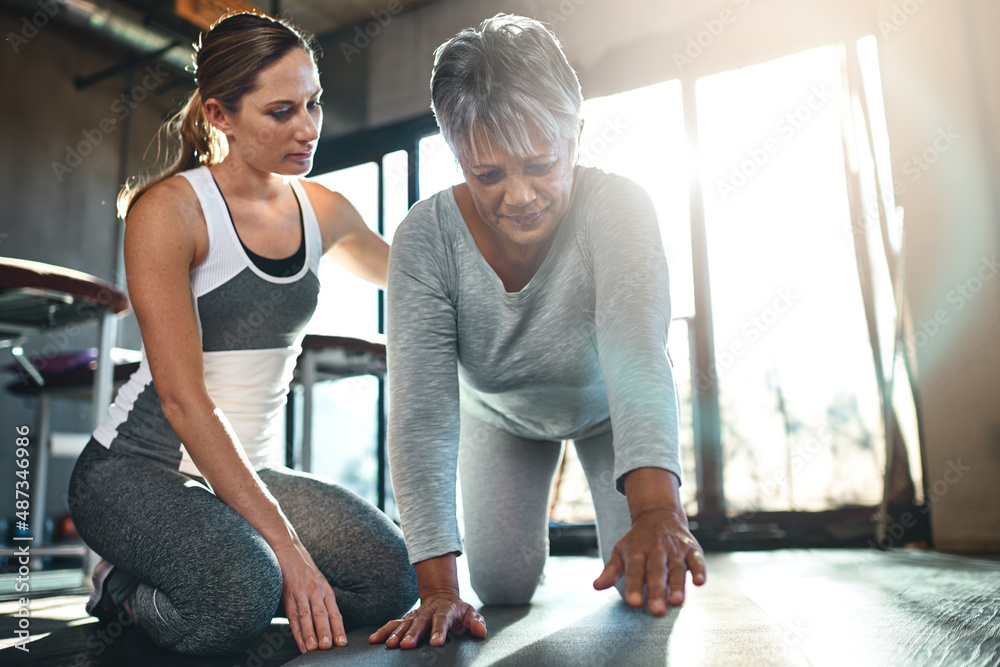 Reversing muscle decline with the help of a physical therapist. Shot of a senior woman working out w