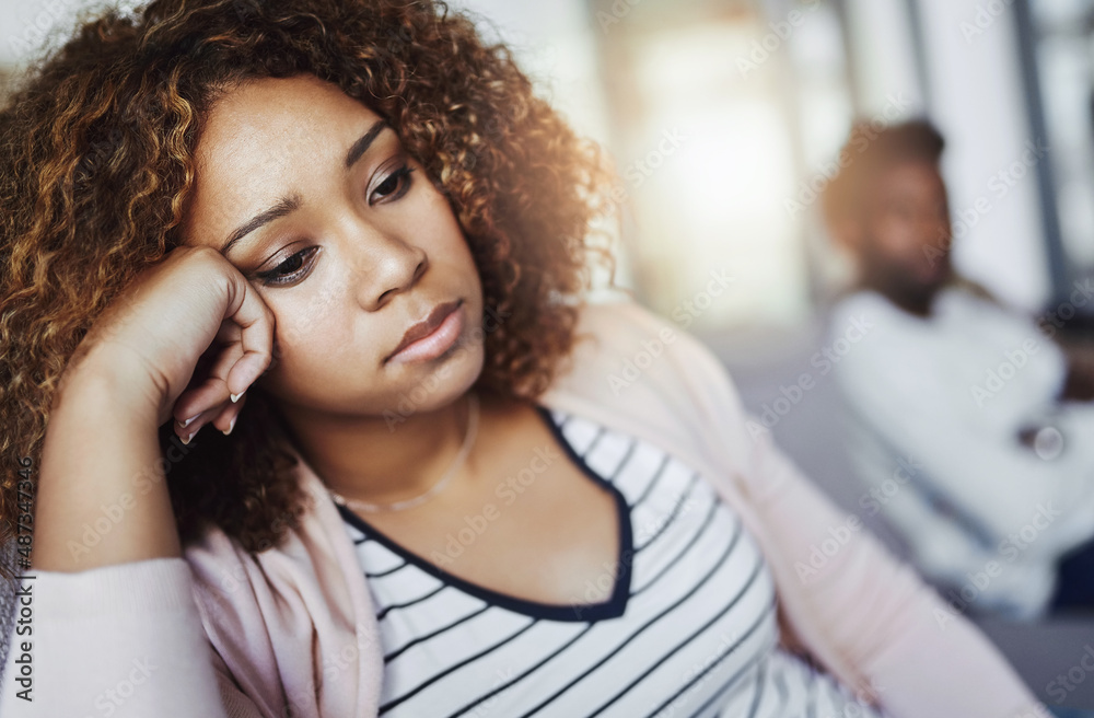 Arguments are a part of every relationship. Shot of a young woman looking despondent after having a 