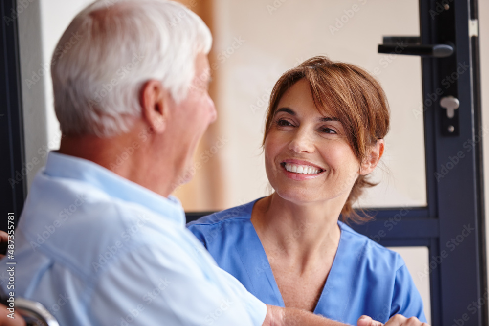 Helping others is her calling. Cropped shot of a female nurse checking on her senior patient.