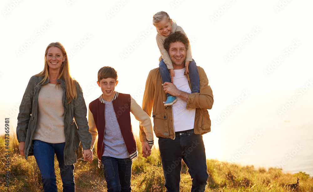 Strengthening the family bond. Shot of a happy family out on a morning walk together.