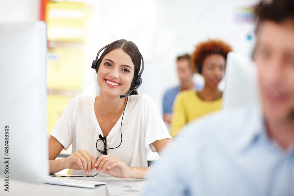 This call center outshines the rest. Cropped portrait of an attractive young call center operator in