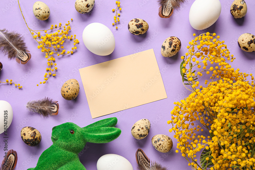 Beautiful Easter composition with blank card, mimosa branches, eggs and feathers on color background