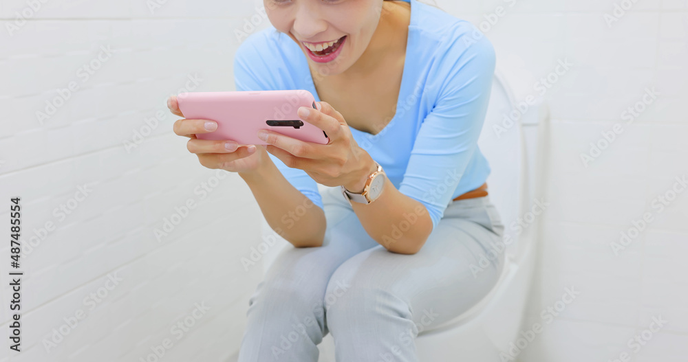 woman use phone in toilet