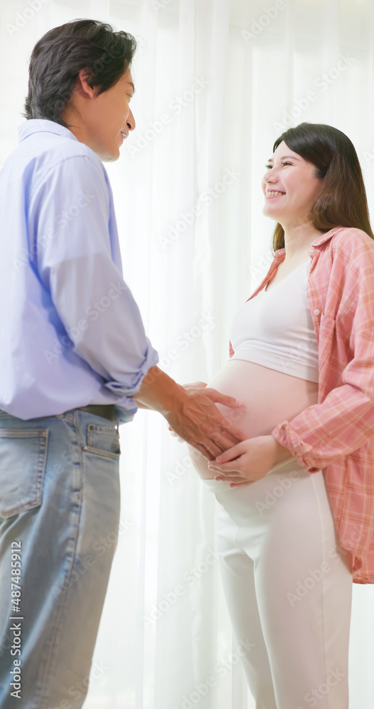 asian pregnant couple feel love