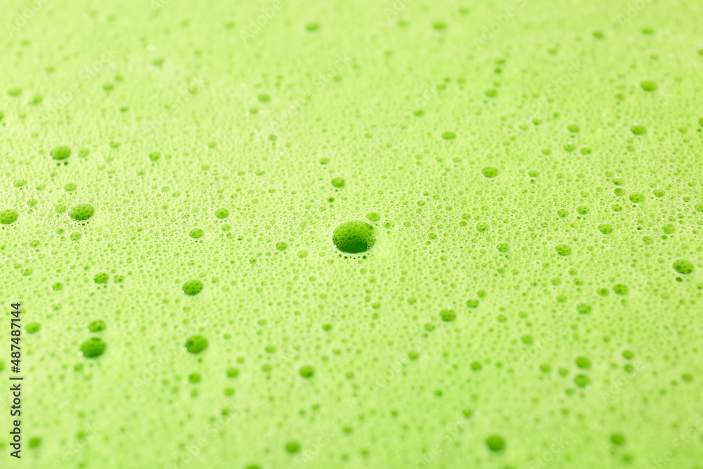 Texture of green thick foam, closeup