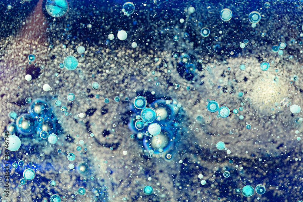 Solid water bubbles on blue background