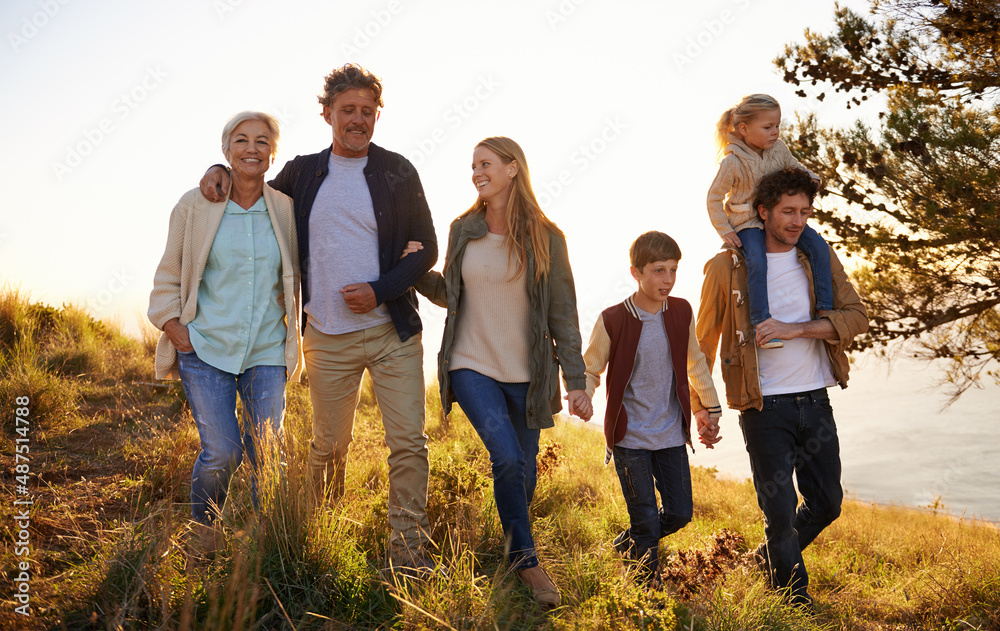 Three generations of happiness. Shot of a happy family out on a morning walk together.