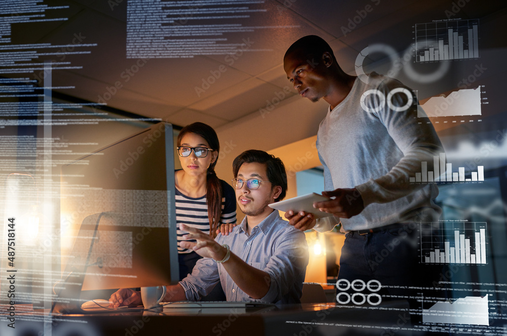 Cracking codes no matter the time. Shot of computer programmers looking through data in the office.