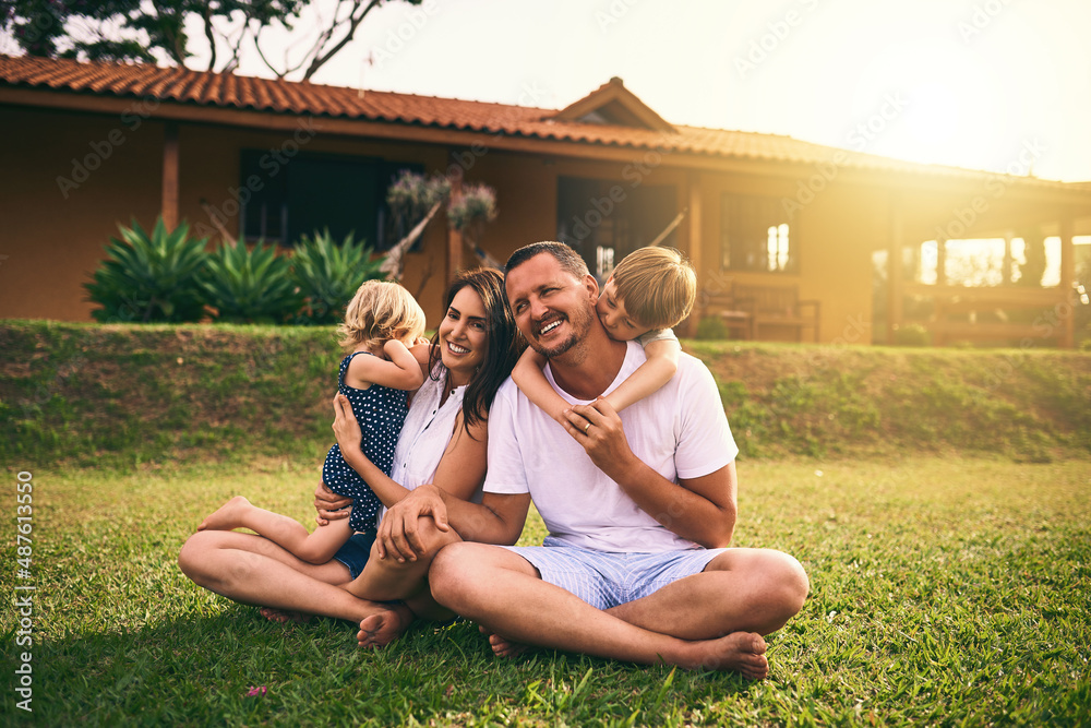 Love them dearly and unconditionally. Shot of a happy family bonding together outdoors.