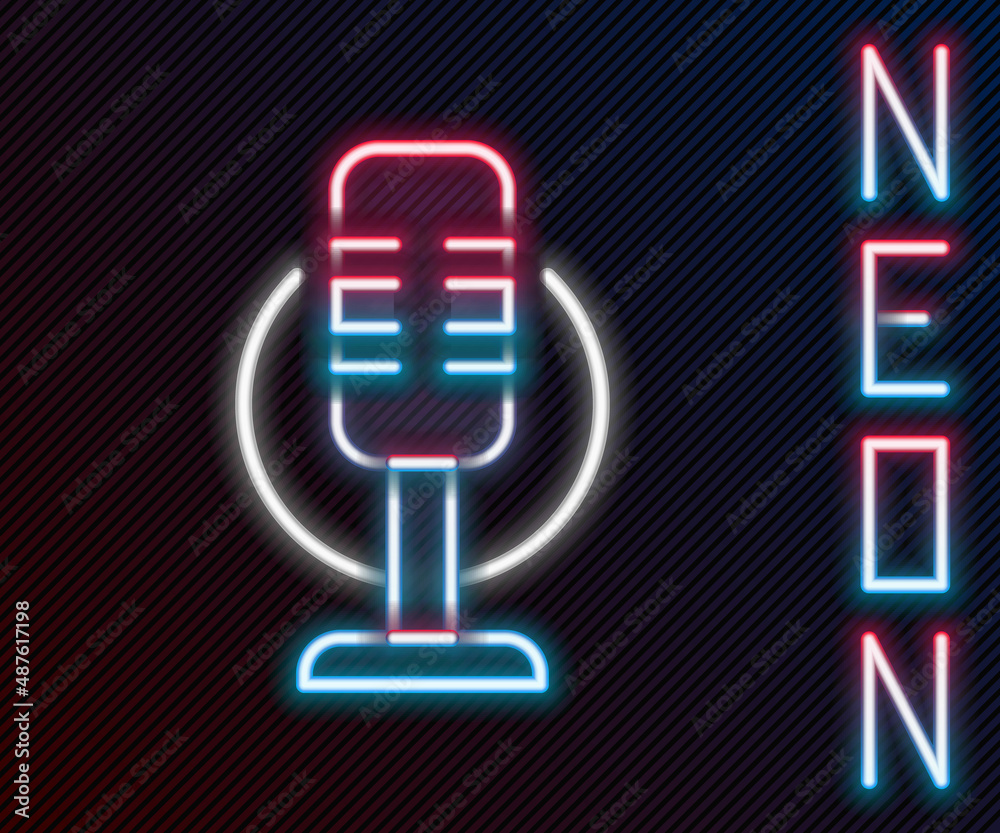 Glowing neon line Microphone icon isolated on black background. On air radio mic microphone. Speaker