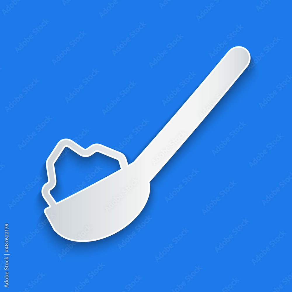 Paper cut Spoon with sugar icon isolated on blue background. Teaspoon for tea or coffee. Paper art s