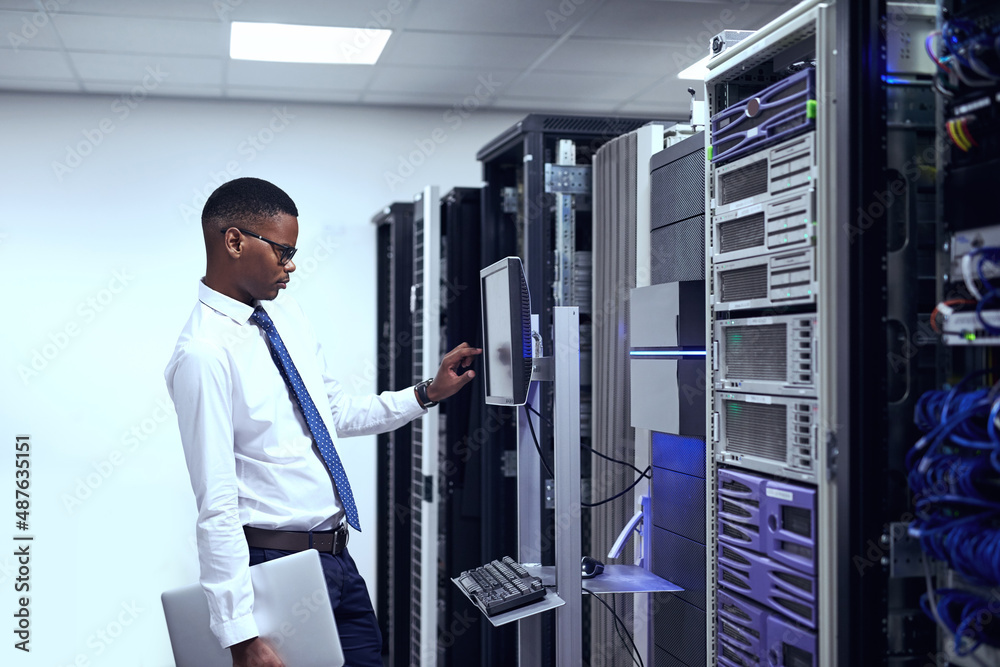 Everything seems to be in order. Cropped shot of a IT technician working and checking if all the ser