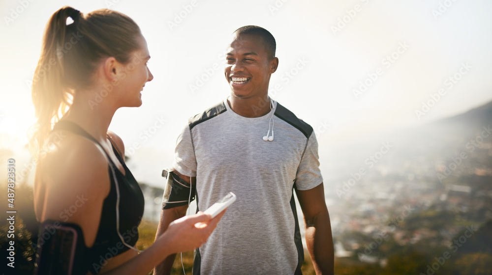 Sharing the same passion for fitness. Shot of a fit young couple working out together outdoors.