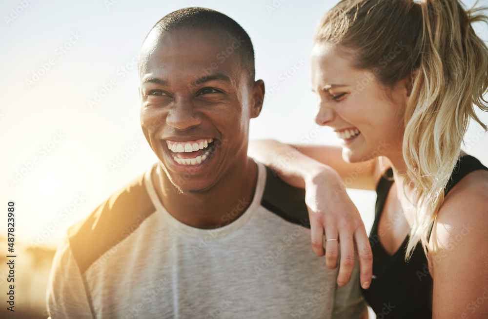 Partners in life and fitness. Shot of a fit young couple working out together outdoors.