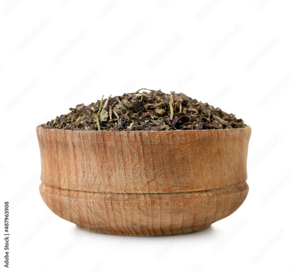 Wooden bowl of aromatic herbal tea on white background