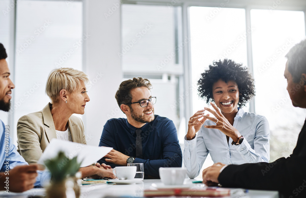 With the help of the whole team, anything is possible. Shot of a group of businesspeople sitting tog