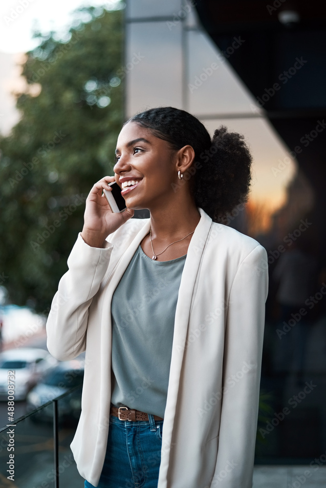 I just stepped out...can you hear me now. Shot of a young businesswoman using a mobile phone out on 