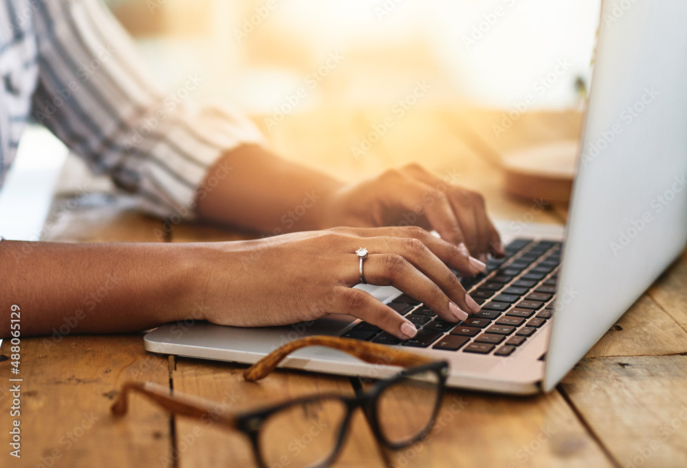 I have some to blog about. Cropped shot of a woman using her laptop on a wooden table.