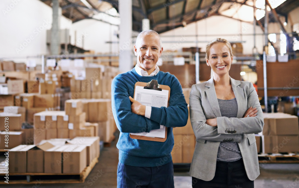 Your shipment is in capable hands. Portrait of two managers standing in a distribution warehouse.