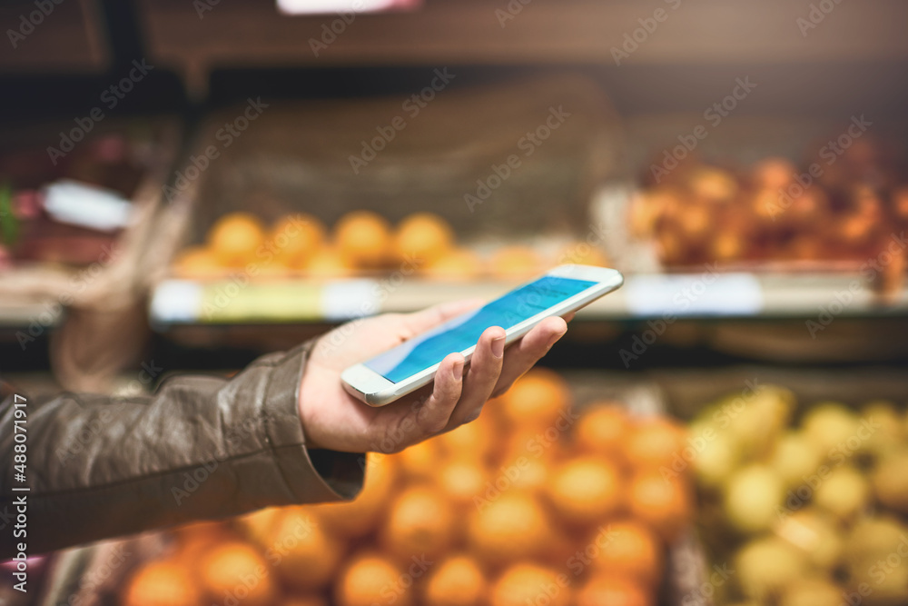 The humble shopping list just got a modern makeover. Cropped shot of a woman using a mobile phone in