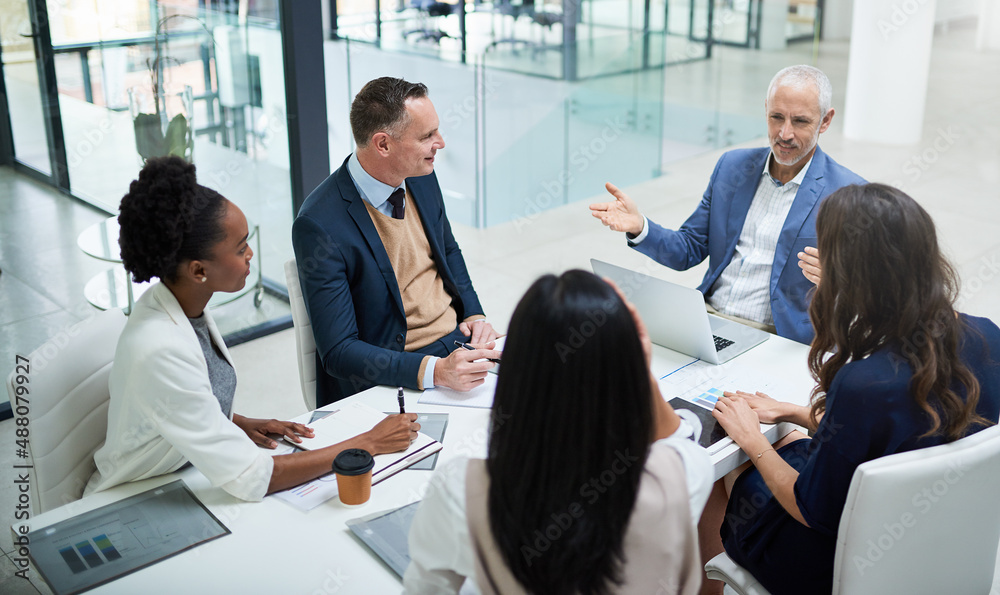 Taking charge of business. Cropped shot of businesspeople having a meeting in a modern office.