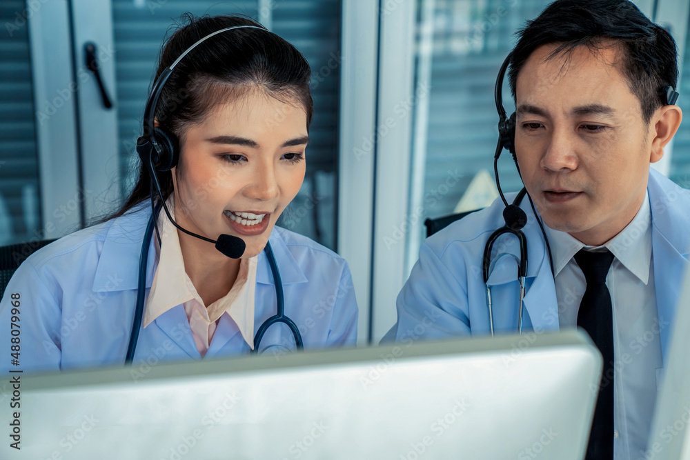 Doctor team wearing headset talking actively on video call in hospital clinic . Concept of telehealt