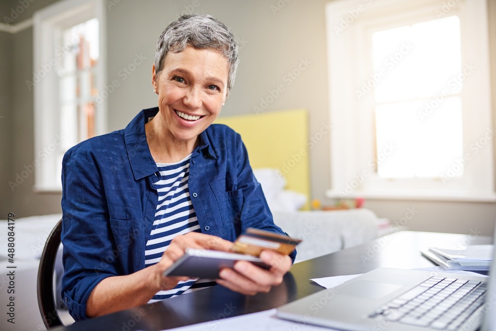 I dont even have to leave the house to pay my bills. Cropped portrait of a senior woman using her ce