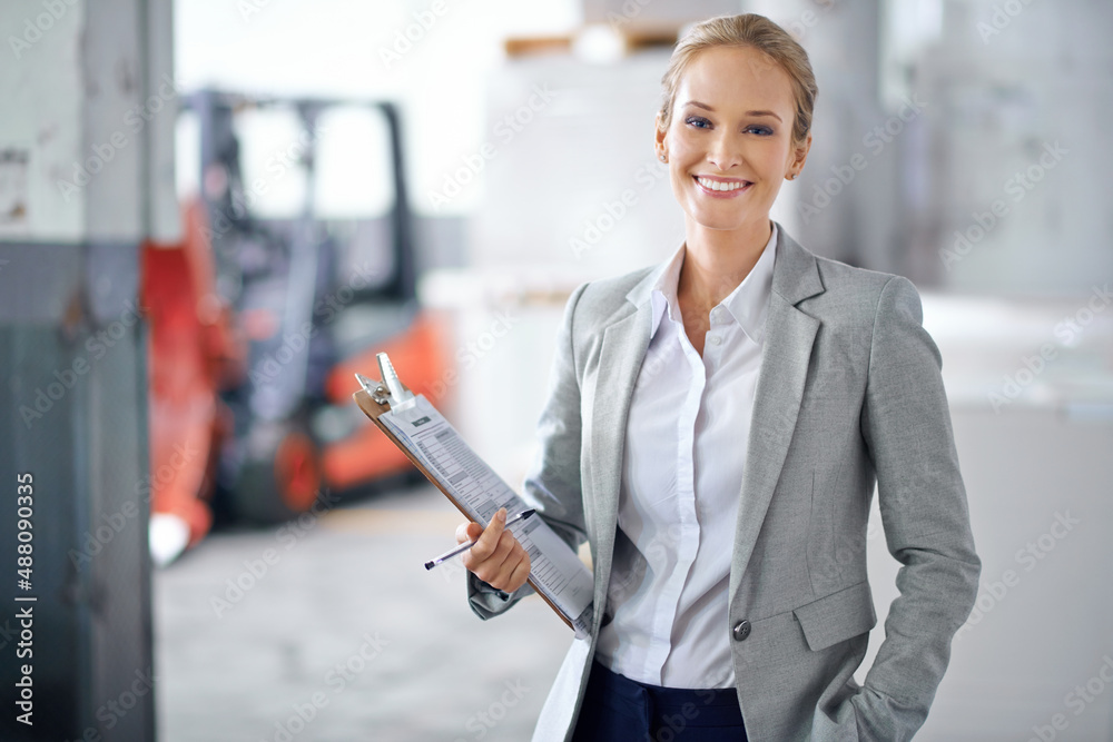 I ensure success every step of the way. A young manager looking confident while on the factory floor