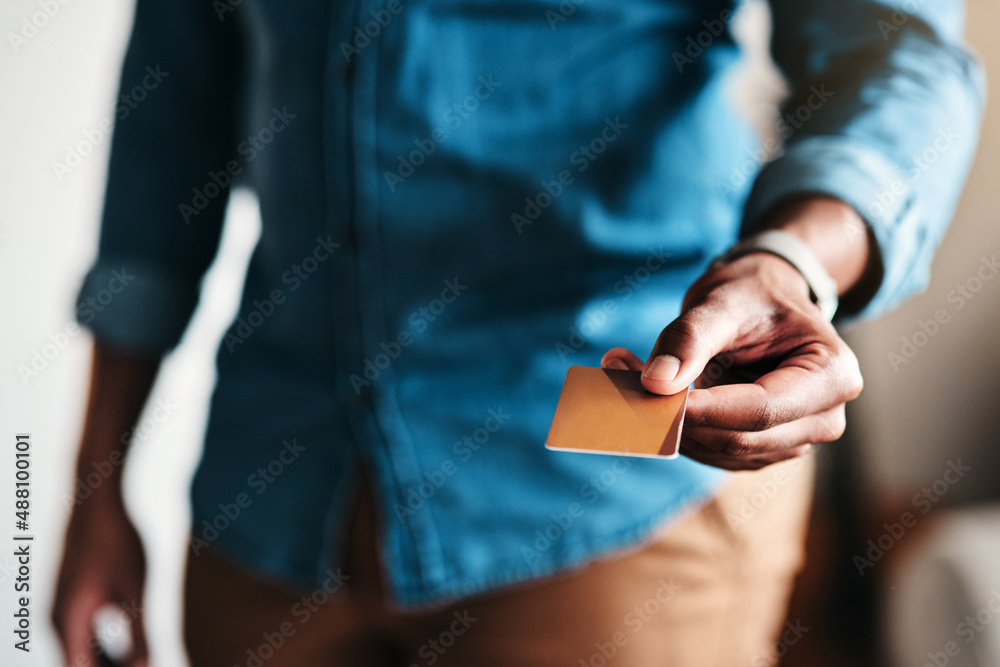 Where do I pay. Cropped shot of an unrecognizable businessman standing alone in his home office and 