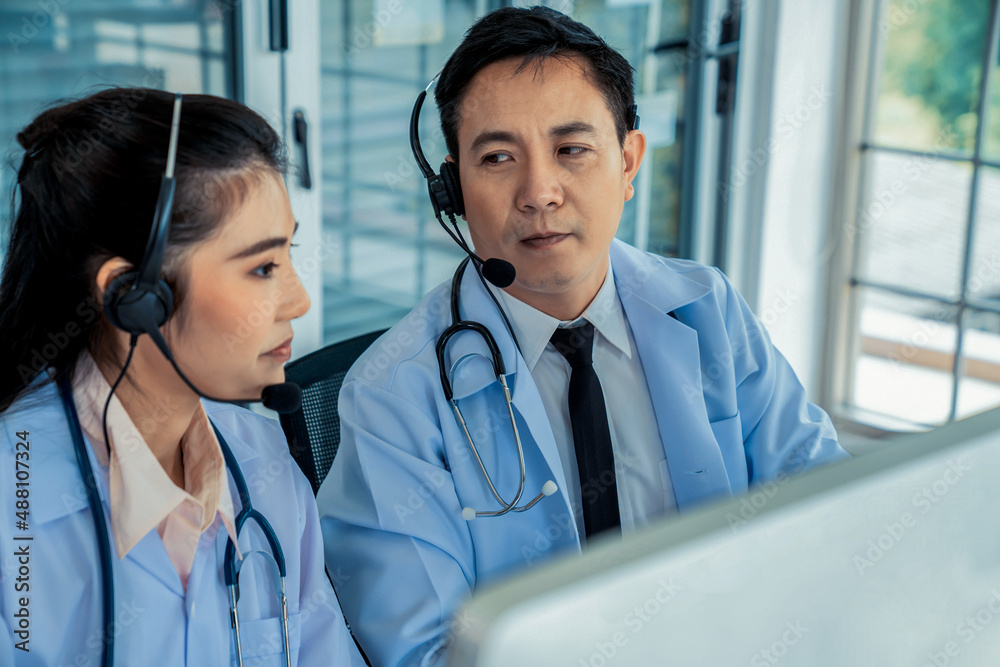 Doctor team wearing headset talking actively on video call in hospital clinic . Concept of telehealt