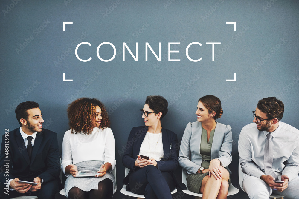 Networking before their interview. Studio shot of businesspeople talking while waiting in line with 