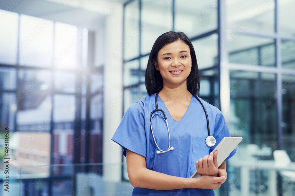 Your health is my priority. Portrait of a young female doctor holding a digital tablet while standin