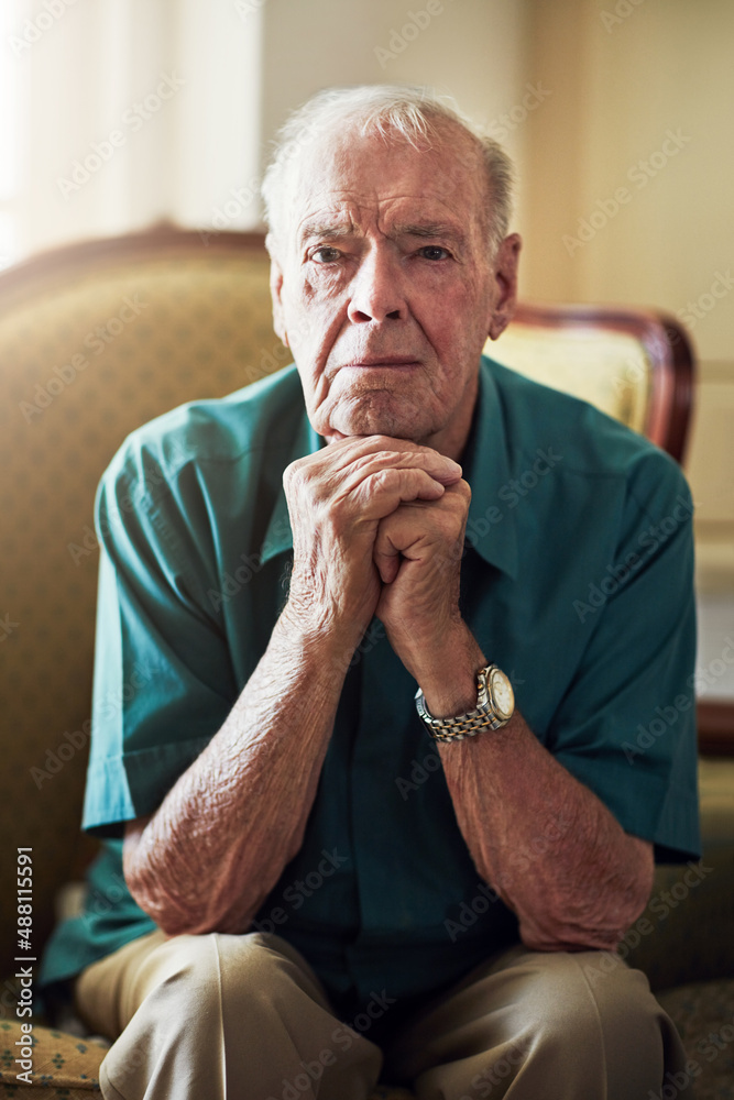 This is where Im spending my retirement. Cropped portrait of a senior man sitting with his hands on 