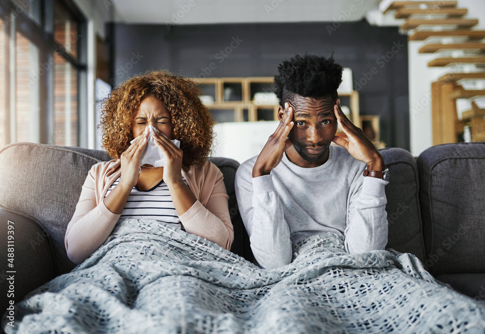 She better not pass on her germs to me. Shot of a young man getting irritated by his girlfriend suff