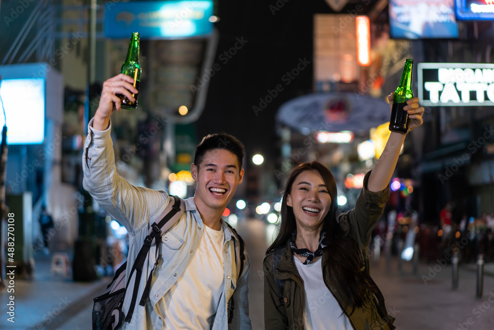 Portrait of Asian couple drinking alcohol and having party together. 