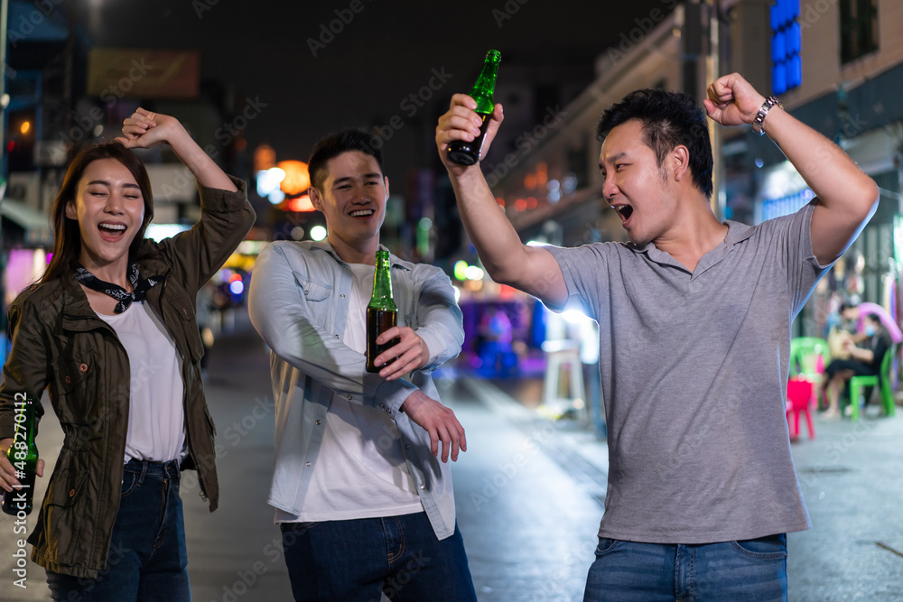 Asian attractive people drinking alcohol with friends and having party. 