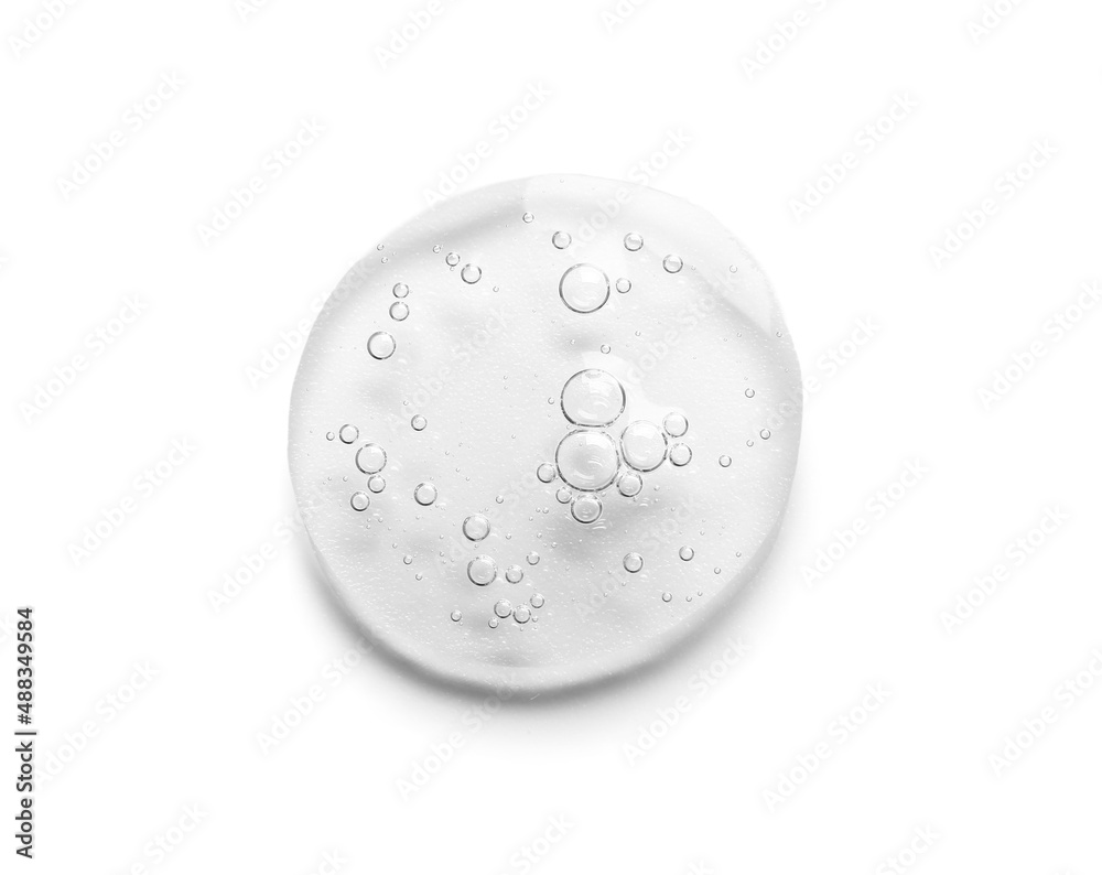 Drop of cosmetic serum on white background