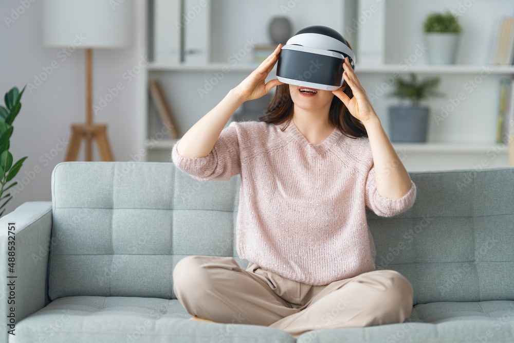 Woman with VR virtual reality goggles